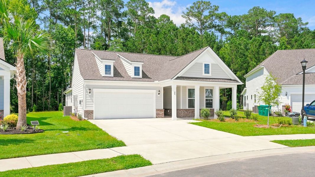 Front exterior of a new home in Midpoint at New Riverside, Bluffton, SC, highlighting curb appeal (Image 2). Front exterior of a new home in Midpoint at New Riverside, Bluffton, SC, highlighting curb appeal (Image 2).