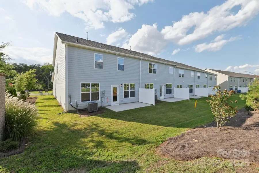 Front exterior of a new home in Blackstone Bay Townhomes, Sherrills Ford, NC, highlighting curb appeal (Image 16).