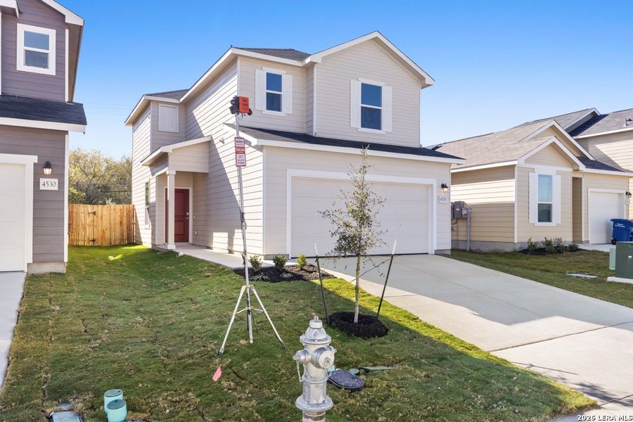 Front exterior of a new home in Spanish Trails Villas, San Antonio, TX, highlighting curb appeal (Image 19).