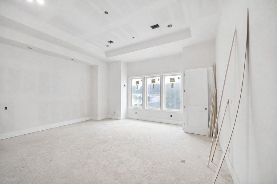 Expansive primary suite featuring soaring high ceilings and an abundance of natural light from massive windows. This private retreat offers a spacious layout with clean modern lines and premium finishes, creating a sophisticated atmosphere for relaxation. The open-concept feel and contemporary design emphasize the exceptional craftsmanship found throughout this luxury bedroom. Expansive primary suite featuring soaring high ceilings and an abundance of natural light from massive windows. This private retreat offers a spacious layout with clean modern lines and premium finishes, creating a sophisticated atmosphere for relaxation. The open-concept feel and contemporary design emphasize the exceptional craftsmanship found throughout this luxury bedroom.