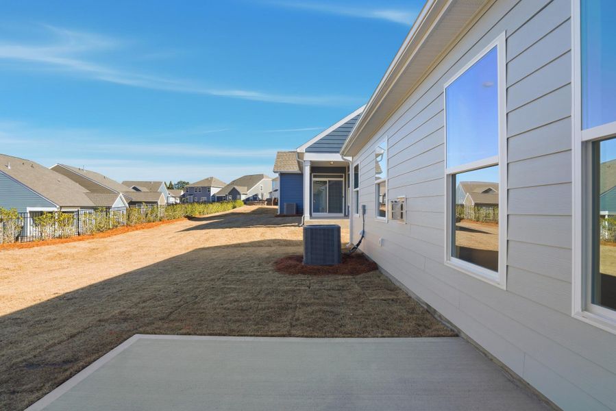 Exterior details and patio area of a home in Villas at Prestwick, Mooresville (Image 27).