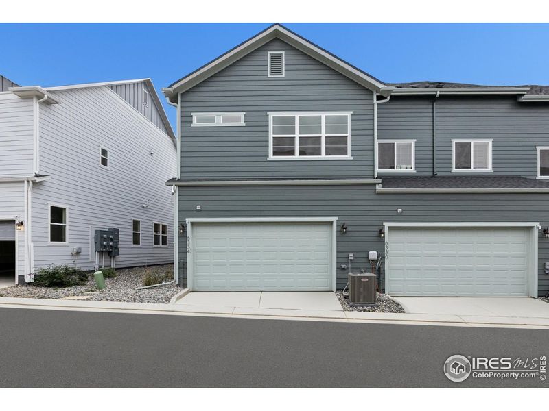 Front exterior of a new home in , Loveland, CO, highlighting curb appeal (Image 26).