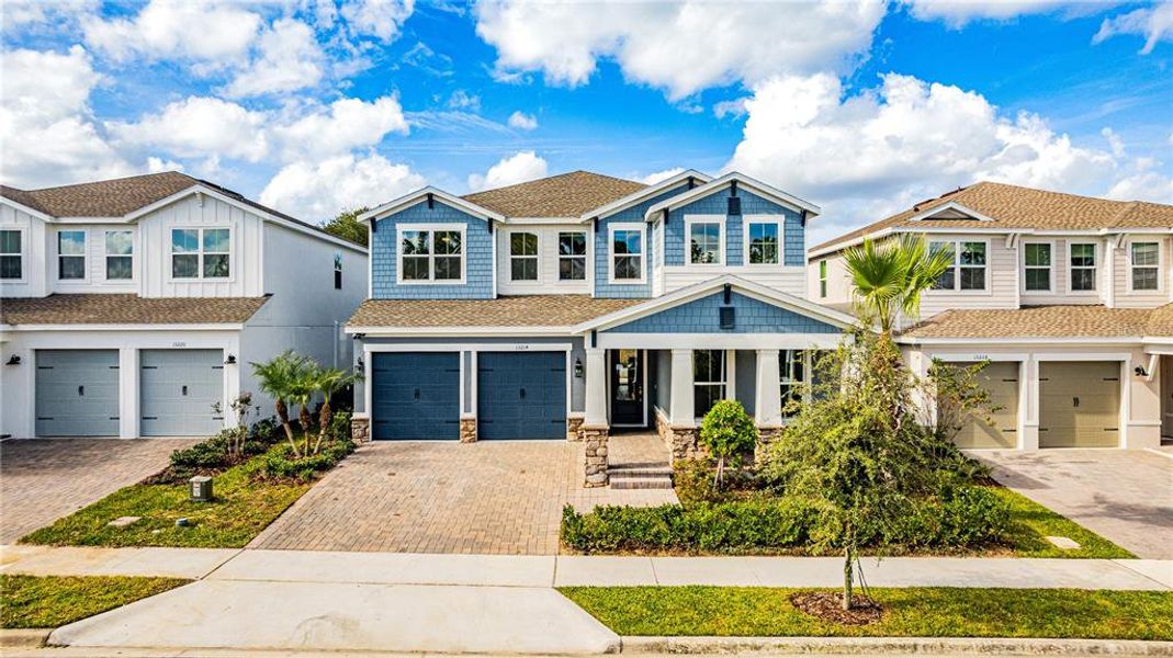 Front exterior of a new home in , Winter Garden, FL, highlighting curb appeal (Image 27). Front exterior of a new home in , Winter Garden, FL, highlighting curb appeal (Image 27).