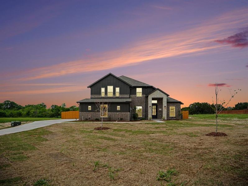 Front exterior of a new home in Ten Mile Creek Estates, DeSoto, TX, highlighting curb appeal (Image 1). Front exterior of a new home in Ten Mile Creek Estates, DeSoto, TX, highlighting curb appeal (Image 1).