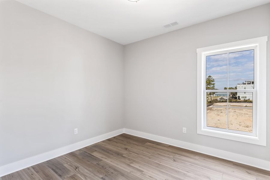 Representative unfurnished interior of a home built from the Pearl by Brock Built in Nautilus Pointe, Inlet Beach (Image 31).