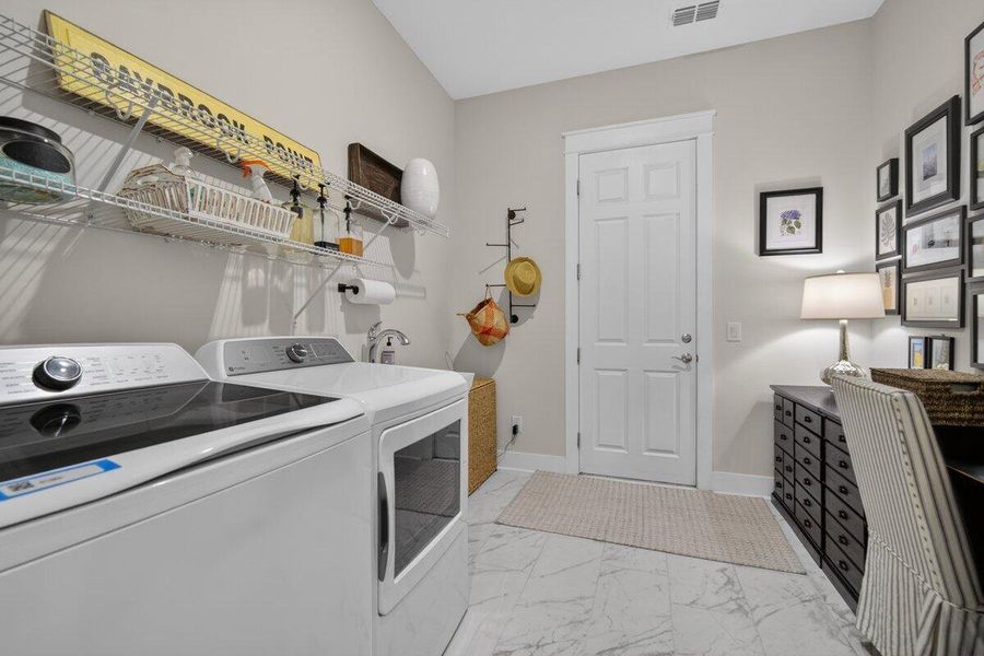 Furnished interior view inside a new home in K. Hovnanian's® Four Seasons at Lakes of Cane Bay, Summerville (Image 34).