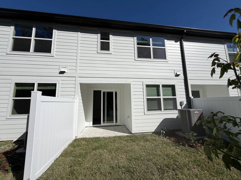 Covered back patio and backyard