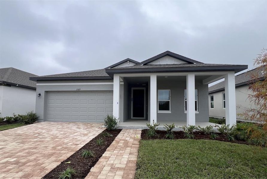 Front exterior of a new home in , Kissimmee, FL, highlighting curb appeal (Image 16).