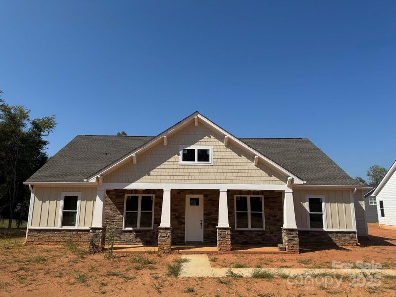 Front exterior of a new home in Bailey's Glen, Huntersville, NC, highlighting curb appeal (Image 1). Front exterior of a new home in Bailey's Glen, Huntersville, NC, highlighting curb appeal (Image 1).