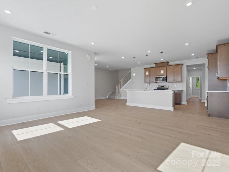 Great Room Surrounded by Energy Efficient Bright Windows.