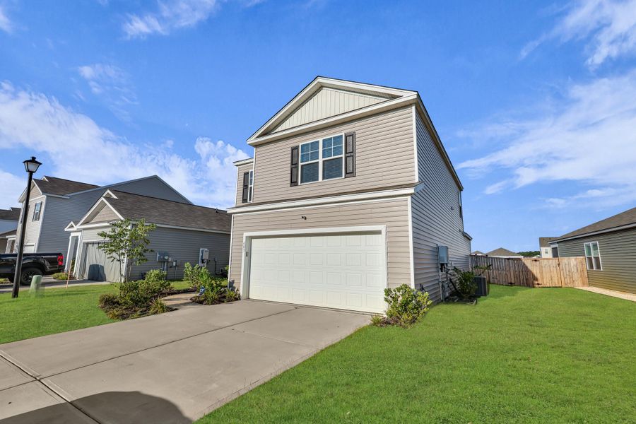 Front exterior of a new home in , Summerville, SC, highlighting curb appeal (Image 20).