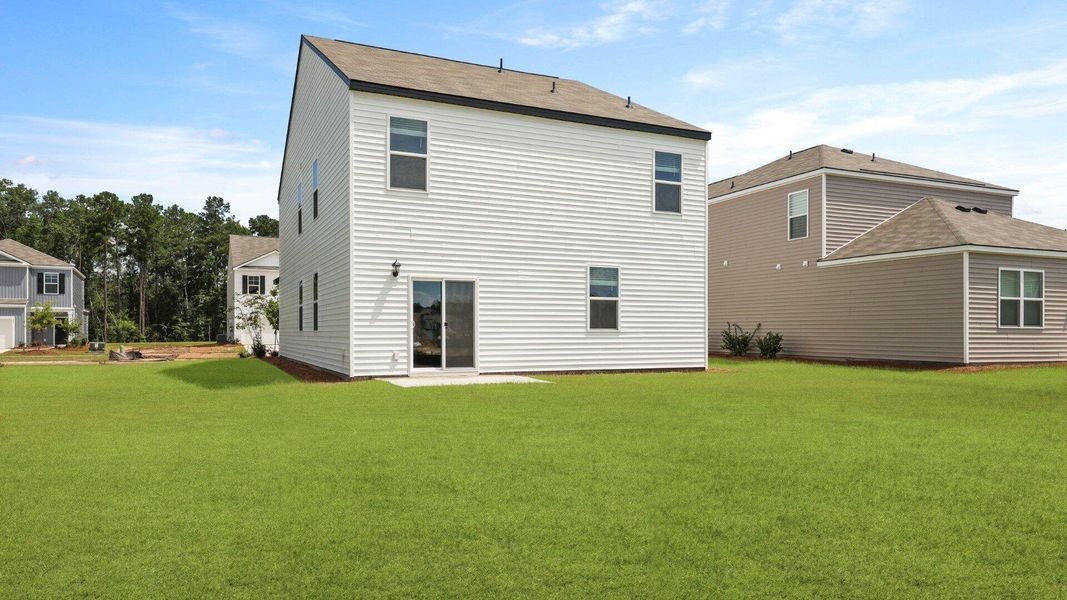 Exterior details and patio area of a home in Pine Hills at Cane Bay, Summerville (Image 2).