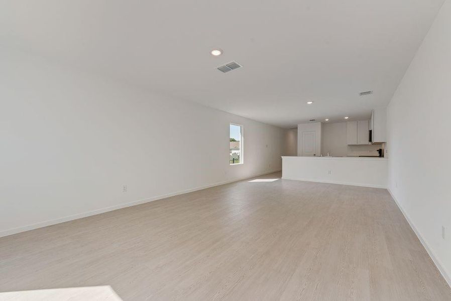 Unfurnished living room featuring recessed lighting and light wood finished floors