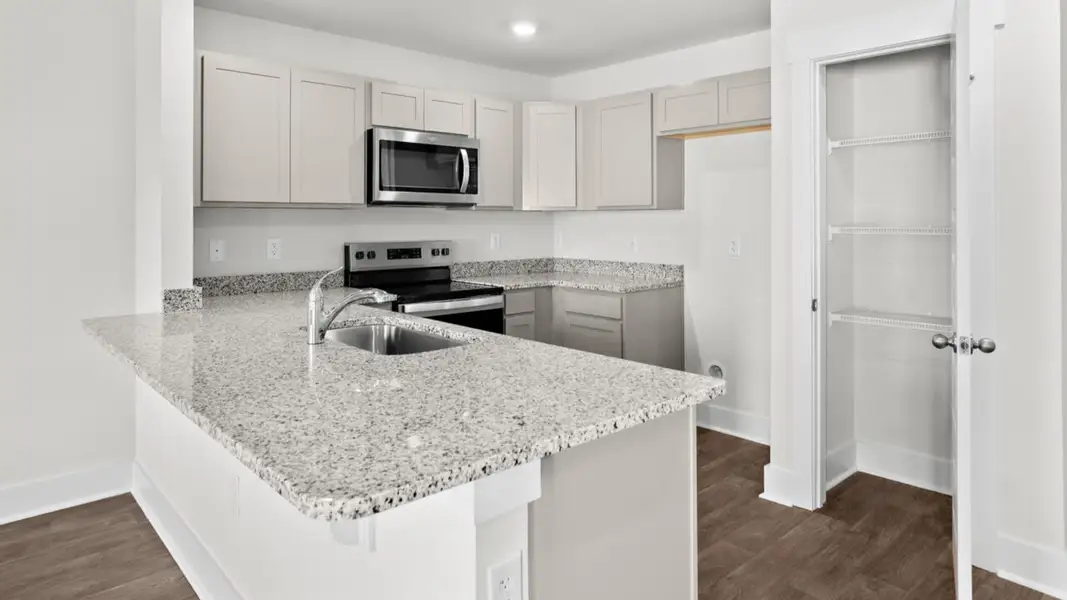 Furnished interior view inside a new home in Indigo Preserve Townhomes, Leland (Image 7).