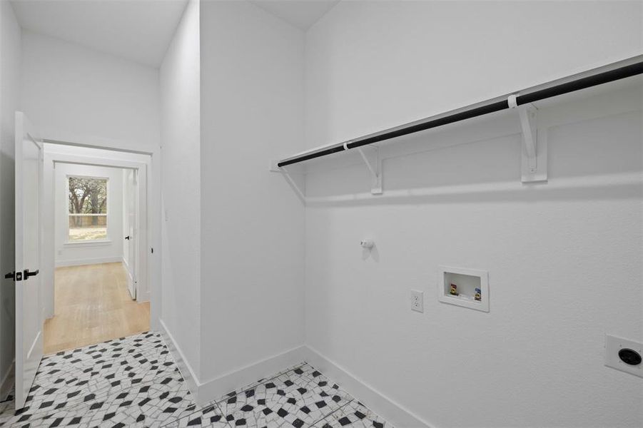 Washroom featuring electric dryer hookup, washer hookup, and hookup for a gas dryer