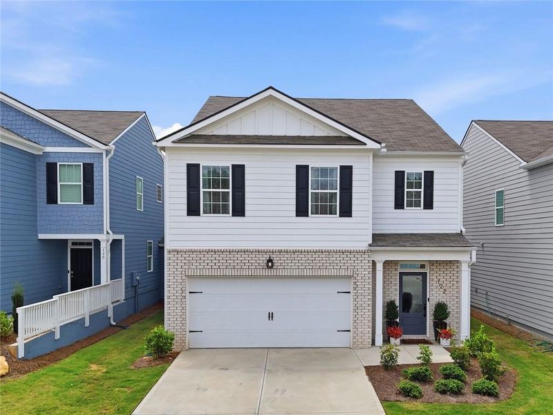 Front exterior of a new home in Rolling Meadows, Jasper, GA, highlighting curb appeal (Image 1). Front exterior of a new home in Rolling Meadows, Jasper, GA, highlighting curb appeal (Image 1).