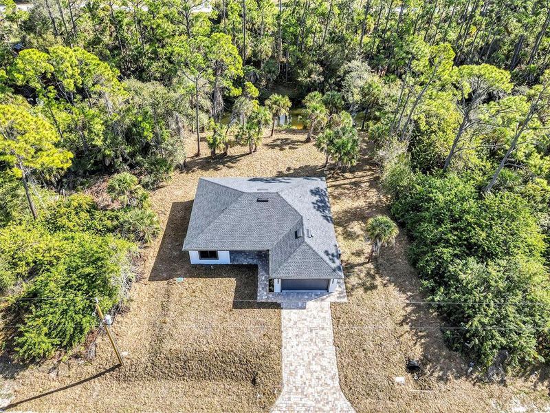 Front exterior of a new home in , Port Charlotte, FL, highlighting curb appeal (Image 21).
