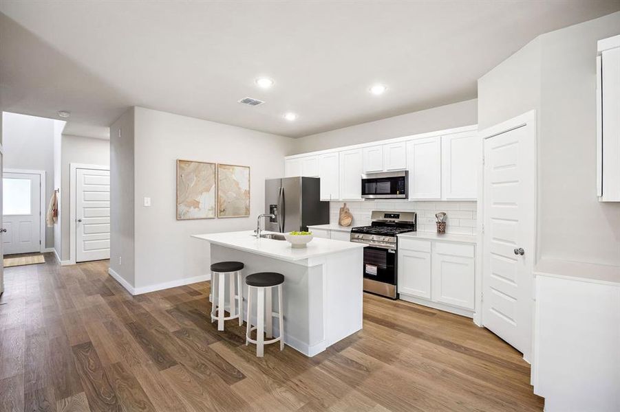Kitchen in the Willow home plan by Trophy Signature Homes – REPRESENTATIVE PHOTO