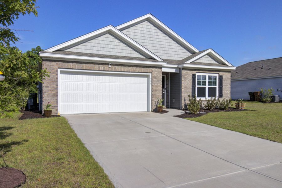 Front exterior of a new home in Stone Ridge, Moncks Corner, SC, highlighting curb appeal (Image 21). Front exterior of a new home in Stone Ridge, Moncks Corner, SC, highlighting curb appeal (Image 21).