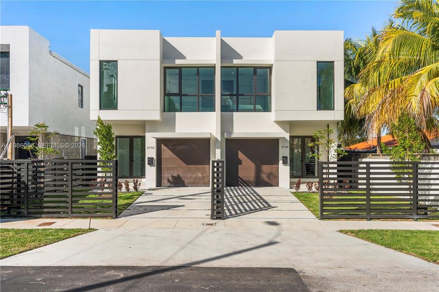 Front exterior of a new home in , Miami, FL, highlighting curb appeal (Image 1). Front exterior of a new home in , Miami, FL, highlighting curb appeal (Image 1).
