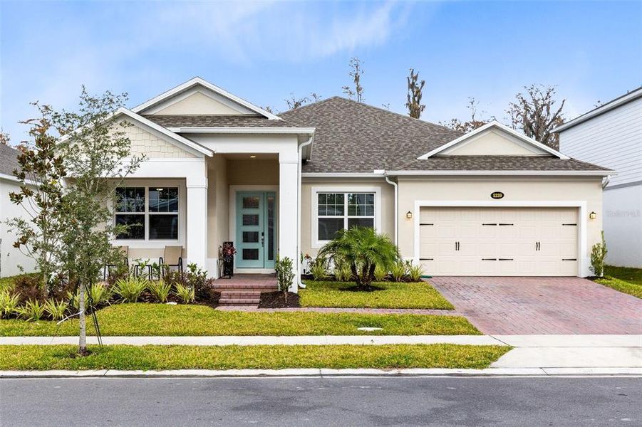 Front exterior of a new home in Eden at Crossprairie, St. Cloud, FL, highlighting curb appeal (Image 1).