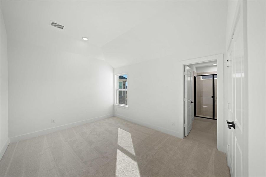 Bonus room featuring light carpet, vaulted ceiling, and recessed lighting Bonus room featuring light carpet, vaulted ceiling, and recessed lighting