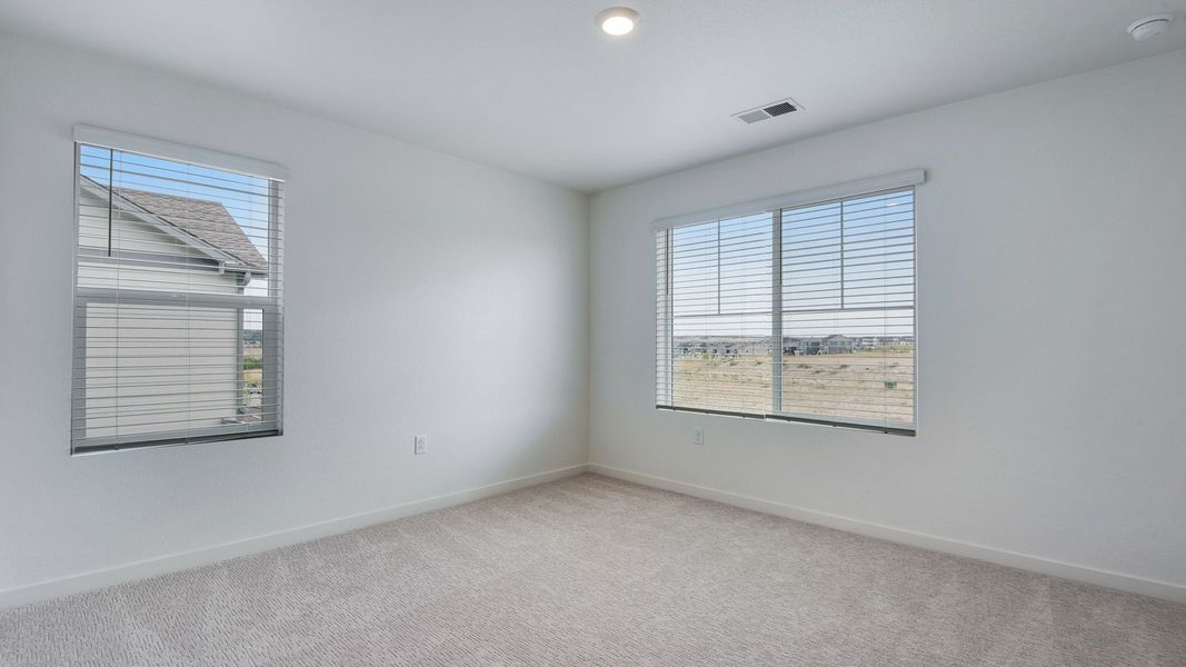 Spacious, unfurnished interior of a new home in Trails at Crowfoot, Parker (Image 24).