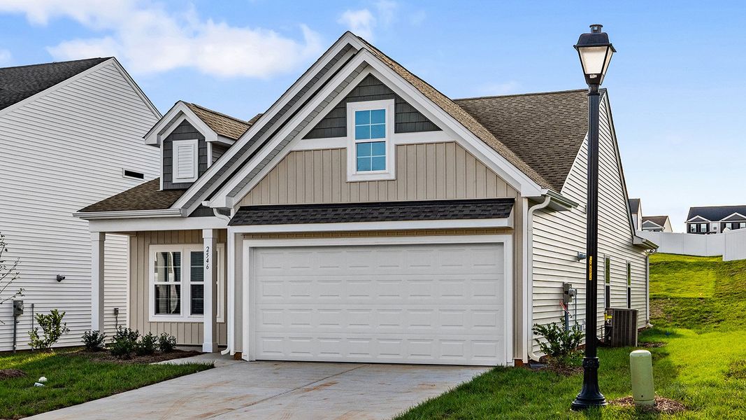 Front exterior of a new home in Hanes Lake, Winston-Salem, NC, highlighting curb appeal (Image 19). Front exterior of a new home in Hanes Lake, Winston-Salem, NC, highlighting curb appeal (Image 19).
