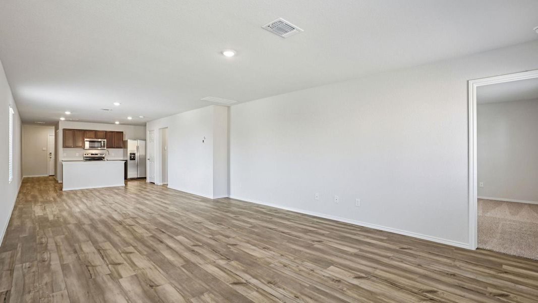 Unfurnished living room featuring recessed lighting and light wood-style floors