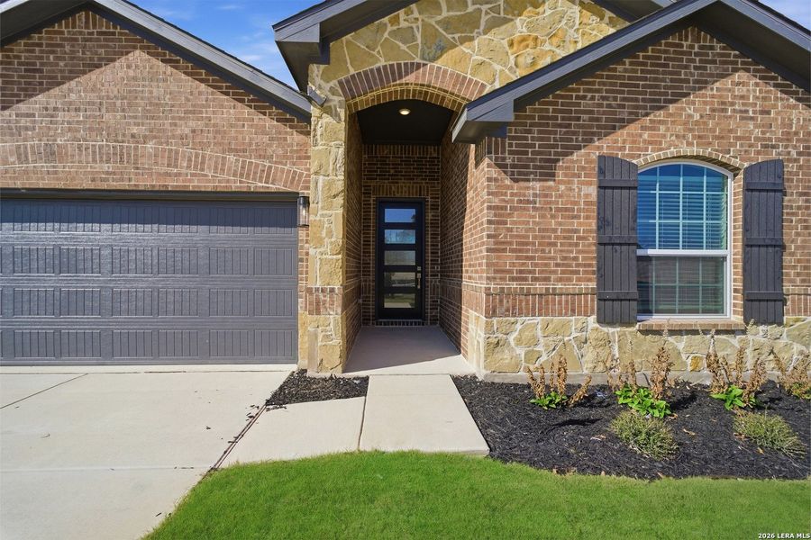 Exterior details and patio area of a home in The Woodlands at Medina Hills, Mico (Image 4).