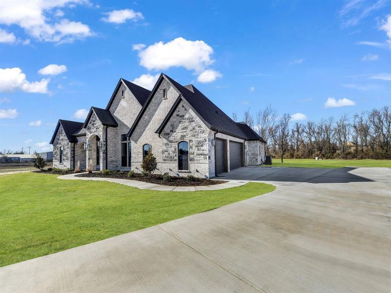 Front exterior of a new home in , Weatherford, TX, highlighting curb appeal (Image 26).