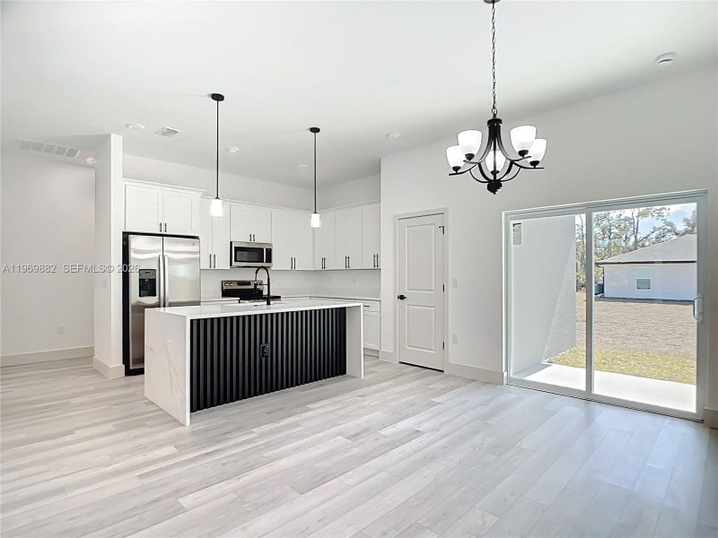 Furnished interior view inside a new home in , Port Charlotte (Image 12).