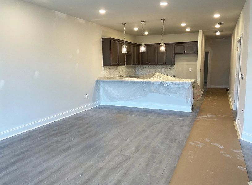 Living Room to Dining Area and Kitchen