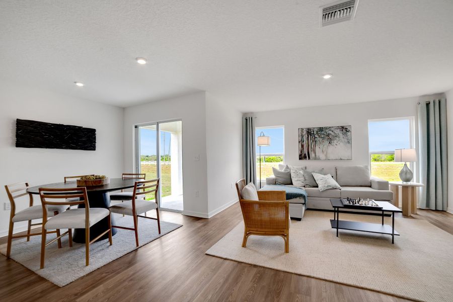 A living room with a large glass door.