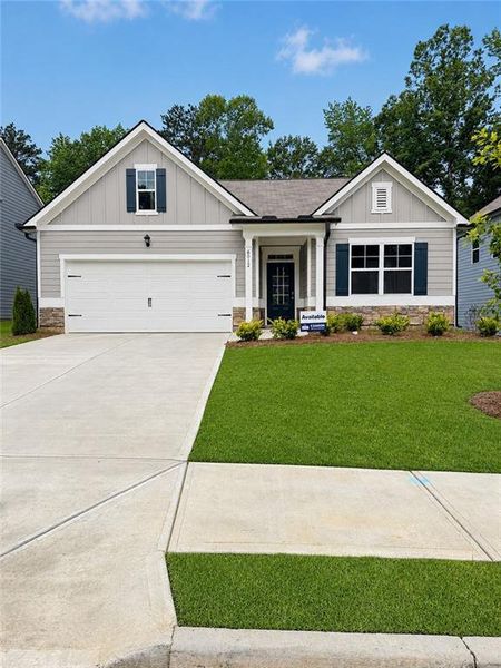 Front exterior of a new home in South Wind, Fairburn, GA, highlighting curb appeal (Image 17). Front exterior of a new home in South Wind, Fairburn, GA, highlighting curb appeal (Image 17).