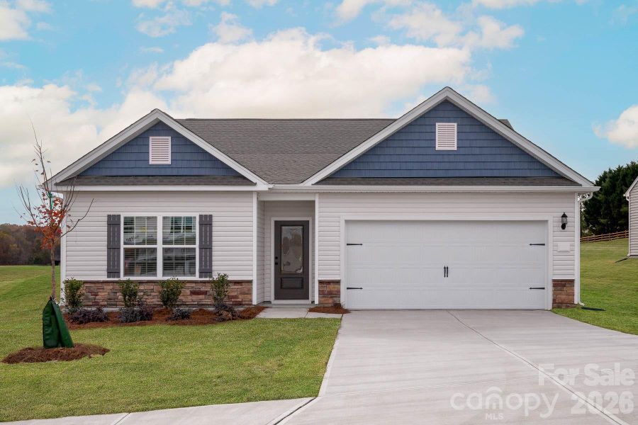 Front exterior of a new home in Colonial Crossing, Troutman, NC, highlighting curb appeal (Image 2). Front exterior of a new home in Colonial Crossing, Troutman, NC, highlighting curb appeal (Image 2).