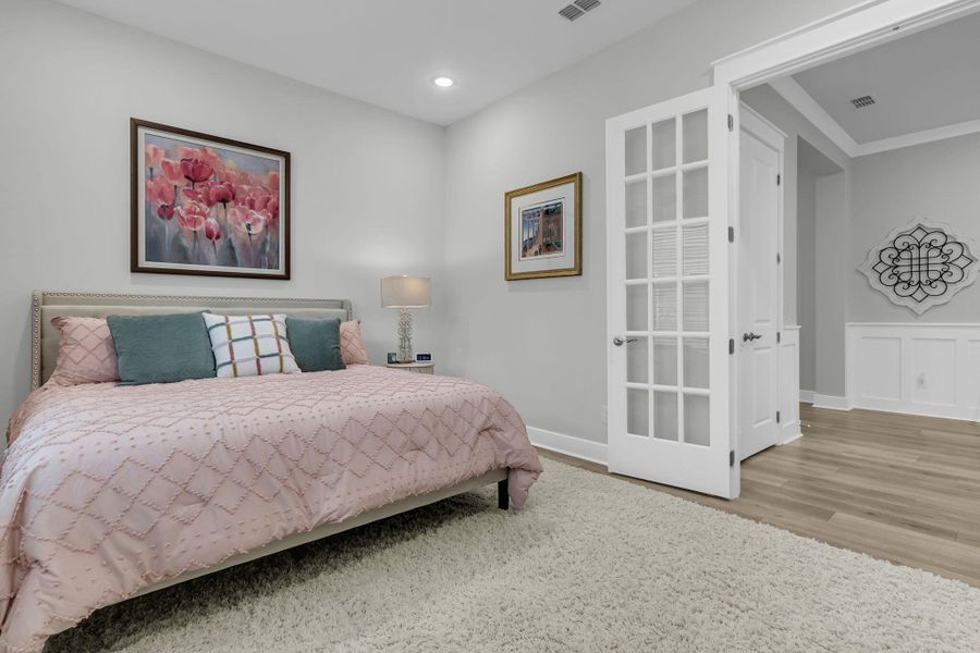 Furnished interior view inside a new home in K. Hovnanian's® Four Seasons at Lakes of Cane Bay, Summerville (Image 38).