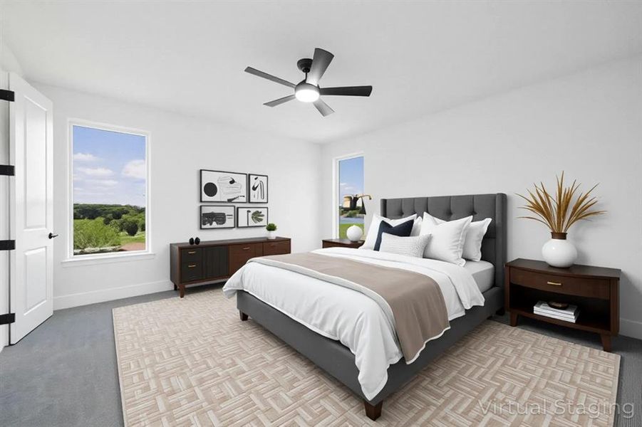 Bedroom with ceiling fan and light colored carpet