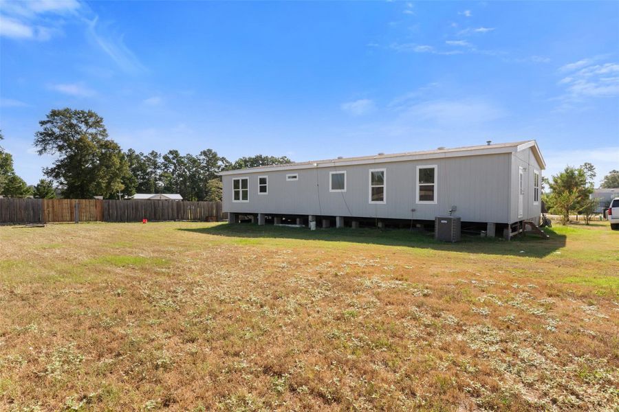 Exterior details and patio area of a home in , Conroe (Image 25).