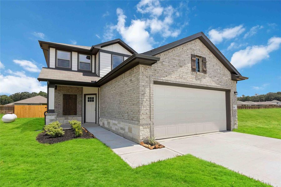 Front exterior of a new home in Liberty Estates, Cleveland, TX, highlighting curb appeal (Image 2). Front exterior of a new home in Liberty Estates, Cleveland, TX, highlighting curb appeal (Image 2).