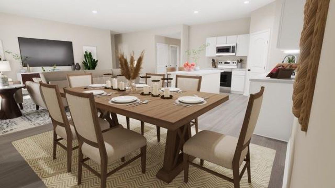 Dining space with light wood-style flooring and recessed lighting