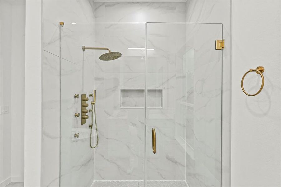 Bathroom with a shower with shower door