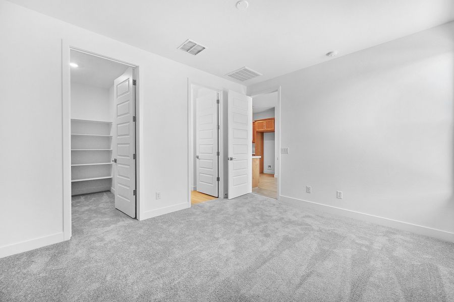 Representative unfurnished interior of a home built from the Caliber by Taylor Morrison in Artisan at Asante, Surprise (Image 29). Representative unfurnished interior of a home built from the Caliber by Taylor Morrison in Artisan at Asante, Surprise (Image 29).