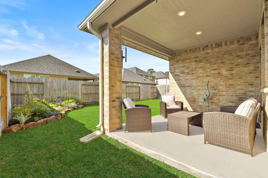 Exterior details and patio area of a home in Harper's Preserve - Traditional Series, Conroe (Image 19).