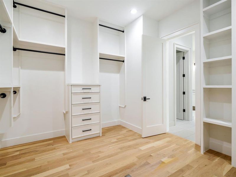 Walk in closet featuring light wood-type flooring