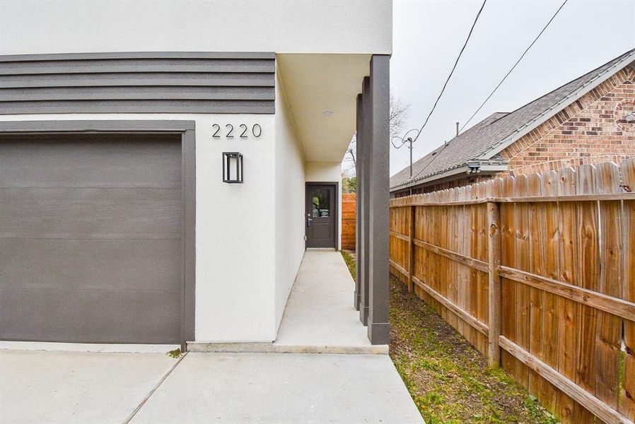 The recessed, covered walkway and front entry afford added privacy.