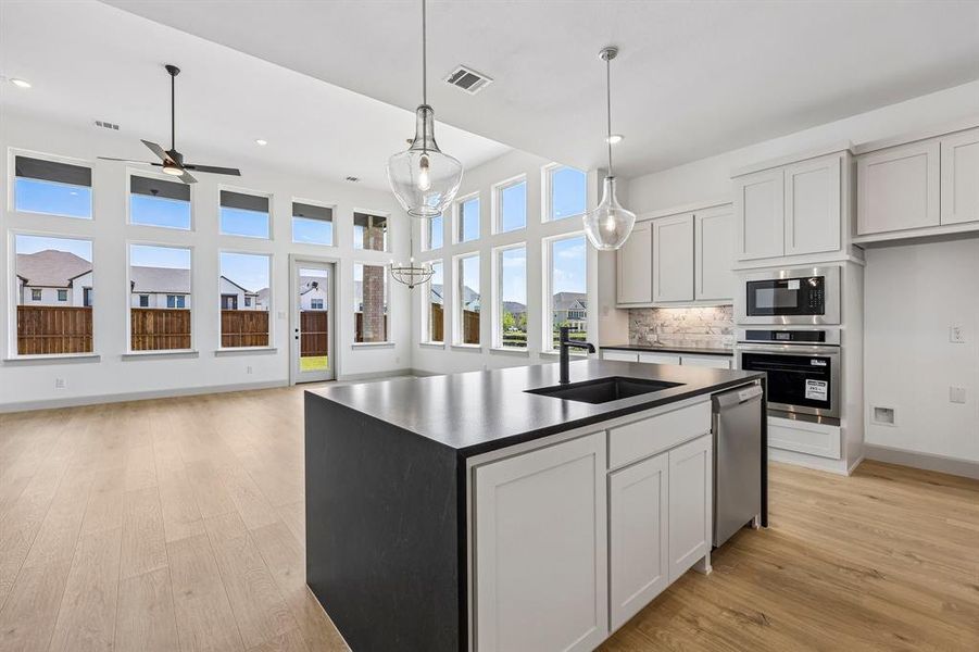 The chef in the family will never be left out of the party in this dramatic, open concept floor plan! The chef in the family will never be left out of the party in this dramatic, open concept floor plan!