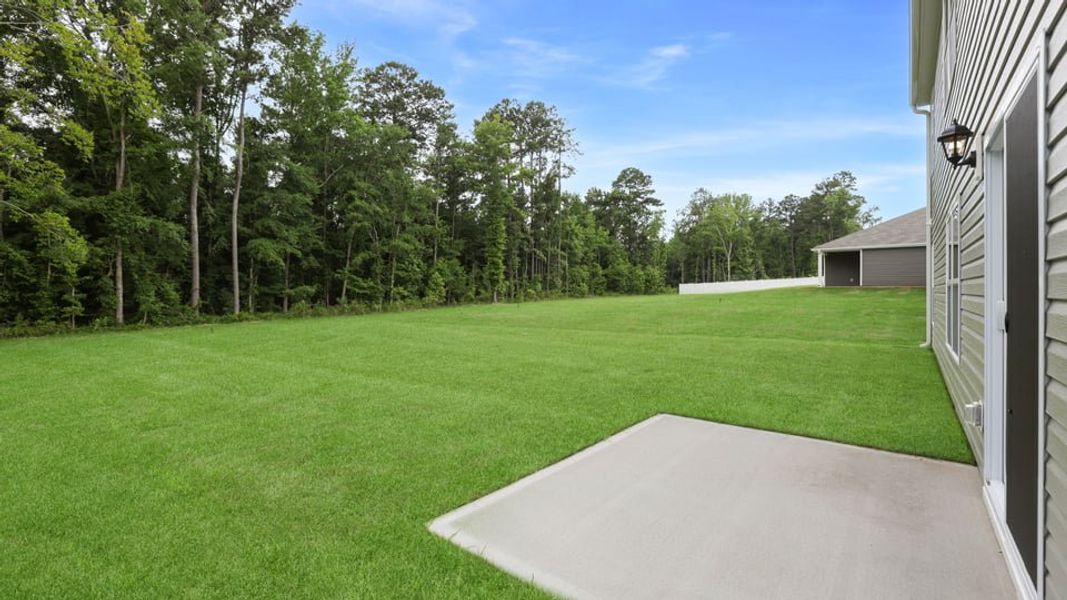 Exterior details and patio area of a home in Hunters Ridge, Woodruff (Image 3).