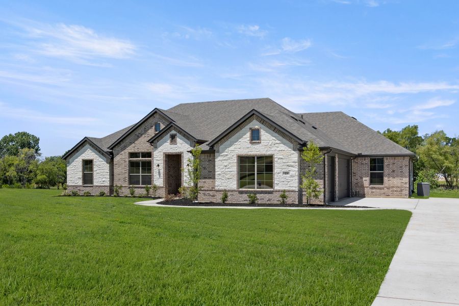 Front exterior of a new home in Mockingbird Hills - Premiere Series, Joshua, TX, highlighting curb appeal (Image 2). Front exterior of a new home in Mockingbird Hills - Premiere Series, Joshua, TX, highlighting curb appeal (Image 2).