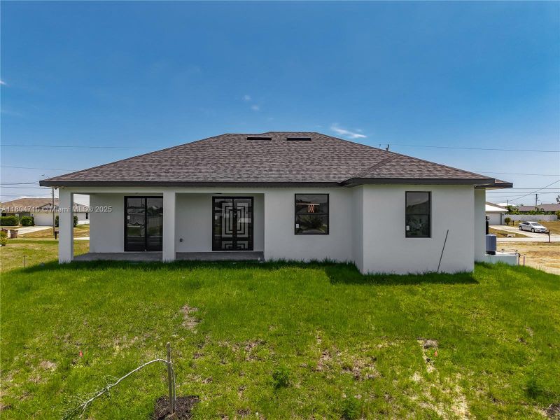 Front exterior of a new home in , Cape Coral, FL, highlighting curb appeal (Image 22). Front exterior of a new home in , Cape Coral, FL, highlighting curb appeal (Image 22).